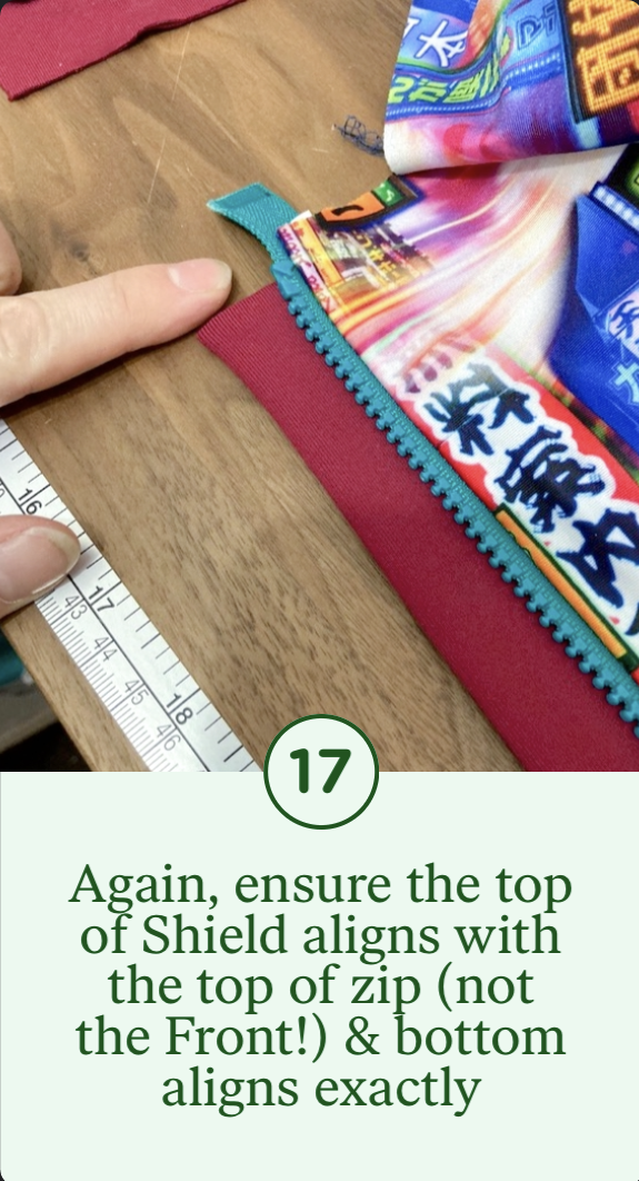 17- Again, ensure the top of the Shield aligns with the top of the zip (not the Front) & bottom aligns exactly